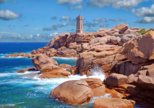 a lighthouse on a rocky beach